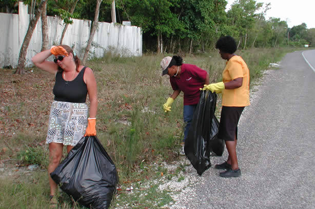 Volunteers Clean-Up Roadside Entrance to Negril - Negril Travel Guide